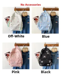 Detail showing quilted striped backpacks in four colors with floral embroidery and tassels