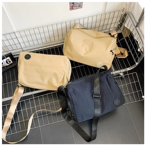 Detailed view of durable nylon crossbody bags with adjustable wide straps and zip closure