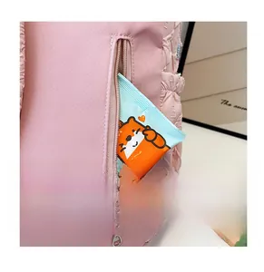 Detailed view of the functional back zipper pocket on this pink striped school backpack