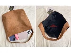 Detailed interior of the brown suede tote bag showing the main pocket and storage capacity
