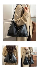 Detail of black large hobo bag with silver hardware and versatile straps for three-way wear