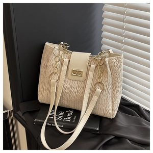 Detail view of woven shoulder bag with golden metallic twist-lock and beige leather trim