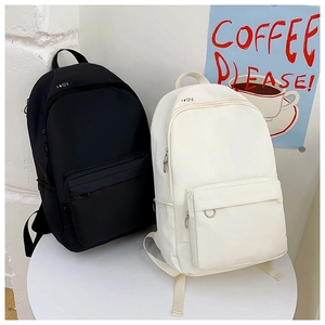 Minimalist black and cream nylon backpacks featuring fun mini icons and metal ring decor