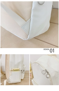 Detail view of reinforced shoulder straps and functional side pockets of the canvas backpack