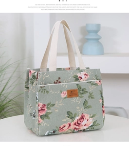 Detail of floral canvas lunch bag featuring green fabric and pink rose patterns