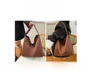 Detailed comparison showing handheld and shoulder styles of the brown leopard suede hobo bag