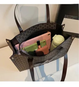Macro shot of large capacity tote bag interior with tablet, phone, and wallet storage