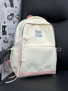 Detail of cream canvas backpack with pink accents and lace bow on a comic background