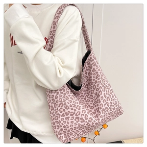 Close-up of pink leopard print suede tote bag with large capacity for daily use