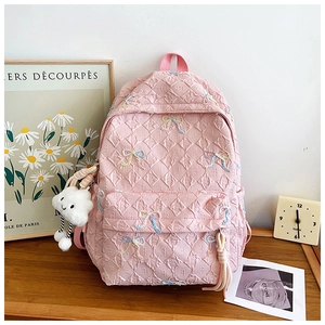 Pink quilted nylon backpack with ribbon embroidery and a white plush cloud charm detail