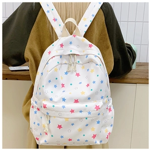 Detailed back view of a student backpack with colorful star patterns on white fabric