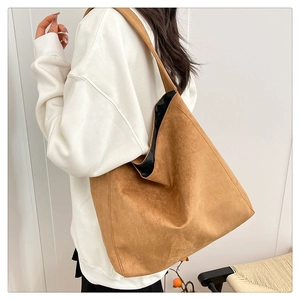 Detailed view of brown leopard print suede tote bag showing its large capacity and soft drapes
