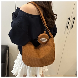 Brown corduroy shoulder bag set showing the crescent hobo bag and matching round coin purse