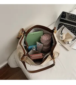 Top-down macro view showing spacious interior capacity of large two-tone tote bag