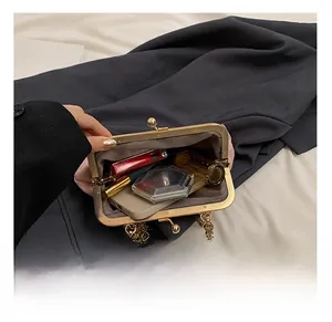 Macro view of pink sequin clutch interior with golden clasp and pearl details