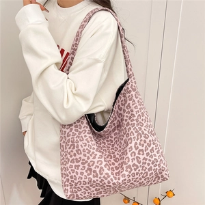 Stylish large leopard print tote bag in pink and purple tones for a chic casual look