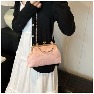 Pink brocade jacquard shell bag with golden metal kiss-lock and detachable chain strap