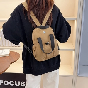 Lightweight khaki nylon travel backpack for women with drawstring closure and top handle