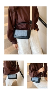 Detail showing dual straps and denim patchwork design of this stylish crossbody bag