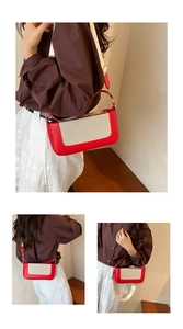 Detail of red and cream contrast shoulder bag with wide fabric strap and leather texture