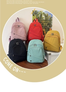 Detailed display of casual nylon backpacks in pink, red, yellow, black and green colors