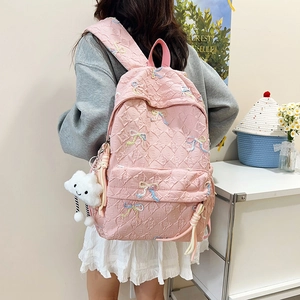 Pink striped quilted backpack for school and travel with cute cloud charm accessory
