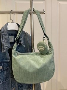 Minimalist green corduroy hobo bag with a matching mini round coin purse and strap