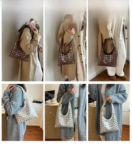 Detailed close-up showing studded large capacity hobo bags in coffee and white leather