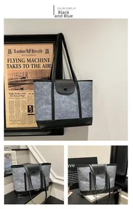 Détails du grand sac cabas en feutre bleu avec finitions en cuir noir et boucle ronde