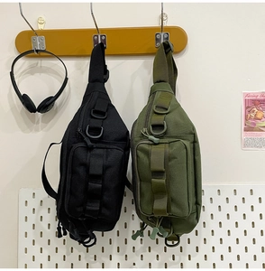 Detail view of durable nylon tactical sling bag with MOLLE system and D-ring attachment