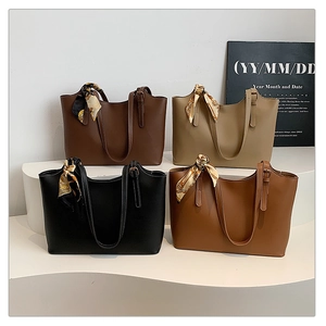 Group display of four minimalist PU leather tote bags with elegant printed silk scarves