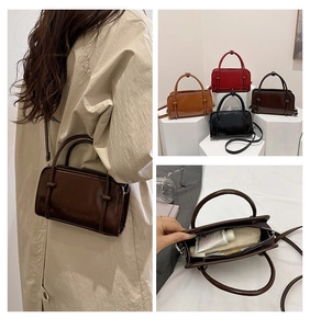 Detail view of retro glossy leather square bag showing internal capacity and multi-color options