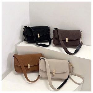 Detail showing retro flip crossbody bags with unique golden peanut metal buckle