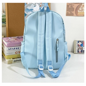 Detailed back view of a light blue student backpack showing anti-theft hidden zipper pocket