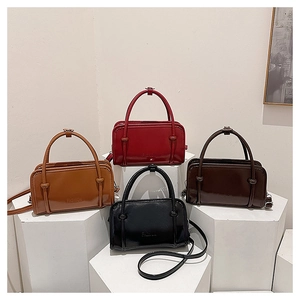 Detailed display of fashionable square handbags in four colors on geometric pedestals