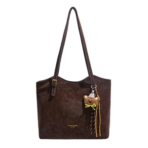 Vintage brown suede tote bag for women featuring a cute bear pendant and top handles