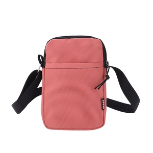 Vertical mini crossbody phone bag in coral red durable nylon with adjustable strap