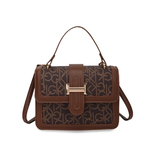 Vintage brown crossbody flap bag with GK letter print and gold rectangular metal buckle