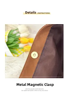 Detailed close-up of premium gold metal magnetic buckle on brown vintage tote bag