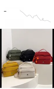 Detailed view of lightweight nylon crossbody bags in five colors with multi-zipper pockets