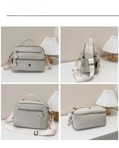 Detailed views of light grey multi-pocket nylon shoulder bag with adjustable strap