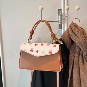 Fashionable caramel and white patchwork crossbody bag with cute bear heart print for women