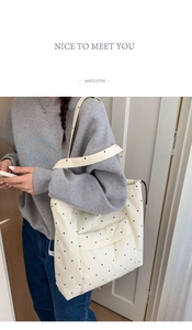 Polka dot canvas tote bag shown as crossbody style for daily commute or yoga