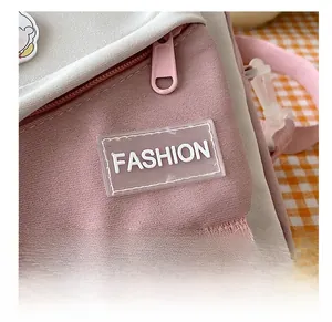 Detail shot of canvas bag stitching with pink fabric and fashion silicone tag