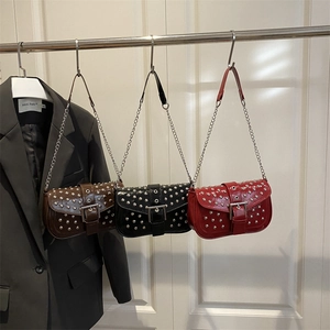 Punk style rivet shoulder bags in caramel, black, and red with silver metal chain straps