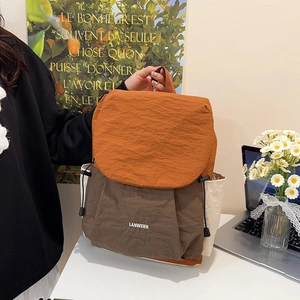 Three-color patchwork travel backpack in nylon with caramel, brown and cream tones