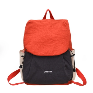Minimalist large capacity travel backpack with red and black color blocking design