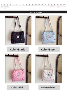 Four colors of cherry print canvas tote bags with chain straps in a 20cm width display