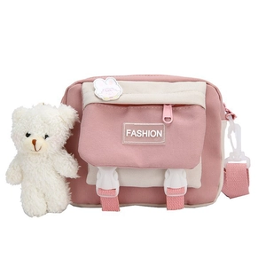 Cute pink canvas mini crossbody bag for women with plush bear and rabbit charms