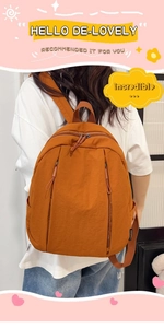 Detailed back view of a caramel waterproof nylon backpack with branded side labels